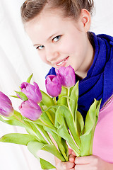 Image showing smiling teenager girl with pink tulips bouquet 