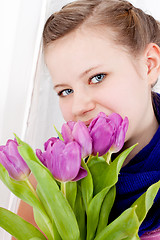 Image showing smiling teenager girl with pink tulips bouquet 