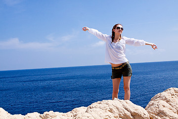 Image showing young girl with brown hat in summer holiday