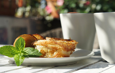 Image showing Sweet cakes and beautiful terrace