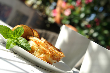 Image showing Sweet cakes and beautiful terrace