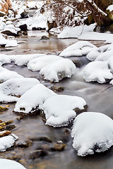 Image showing Falls on the small mountain river in a wood shooted in winter