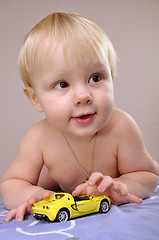 Image showing toddler boy playing with a toy car