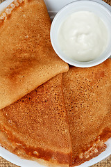 Image showing pancakes with sour cream