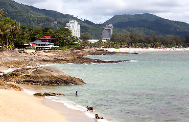 Image showing Thai children are swimming in the wild beach. Editorial only.