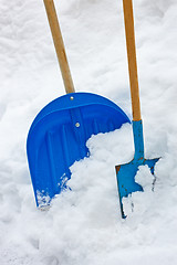 Image showing Two Shovels In The Snow Heap