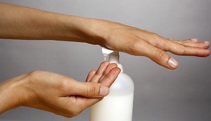 Image showing Applying liquid soap