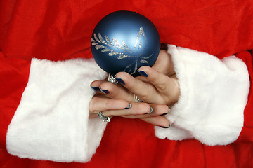 Image showing Santa claus hiding a blue ball