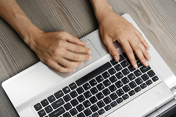 Image showing Young woman with laptop 