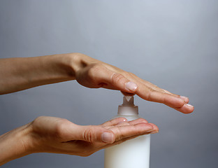 Image showing Applying liquid soap