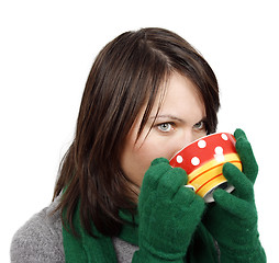 Image showing Woman drinking a hot beverage