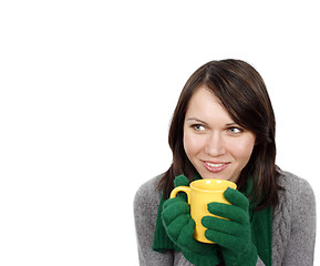 Image showing Woman drinking a hot beverage 