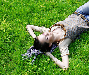 Image showing Female lying on the grass 