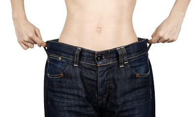 Image showing Slim woman in big jeans