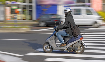 Image showing Scooter in motion