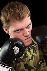 Image showing young man in boxing gloves