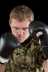 Image showing young man in boxing gloves