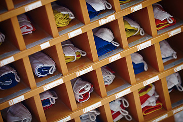 Image showing Marine sea signal flags in wooden cupboard