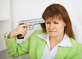 Image showing Upset business woman attempts to commit suicide