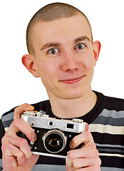 Image showing Satisfied young man with vintage photo camera