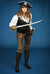 Image showing Young woman in pirate suit with sabre