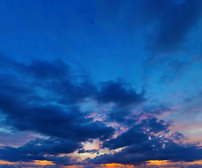 Image showing Sunset on deep blue sky. Panorama from several photos.