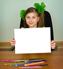 Image showing Schoolgirl artist with white blank paper sheet