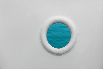 Image showing Ship porthole on white wall