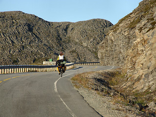 Image showing Lonely cyclist in a wasteland