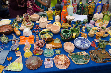 Image showing clay crockery kid craft wares outdoor fair 