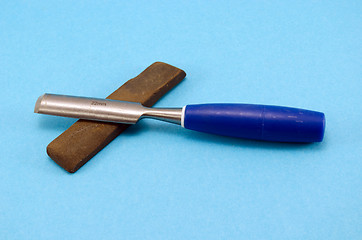 Image showing chisel graver carve tool whetstone wood work blue 