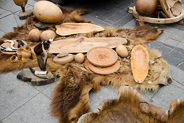 Image showing decorative trays bowls cups of wood on bear fur 