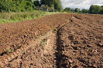 Image showing tractor mark trail soil plow field house farm 