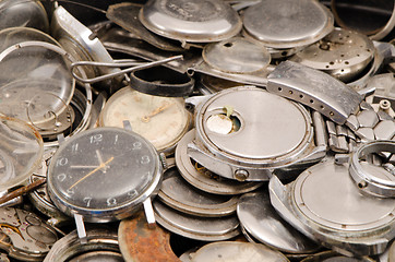 Image showing retro old watches clocks parts pile heap closeup 