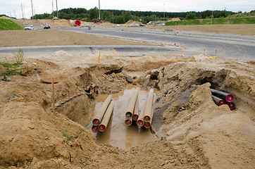 Image showing electricity cable wire protective tube lay road construction 