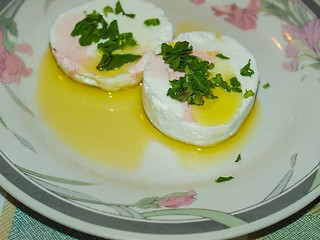 Image showing Tomino cheese with rucola and olive oil