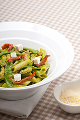 Image showing Italian penne pasta with sundried tomato and basil