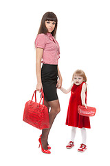 Image showing Fashionable Mom in red shoes and her little daughter with a beau