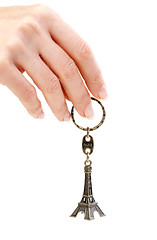Image showing Hand holding small Eiffel Tower statuette