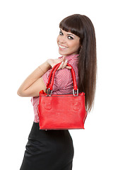 Image showing Portrait of a girl with a fashionable red handbag