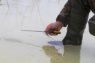 Image showing spring fishing on collapsing ice