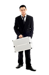 Image showing businessman with metal container #2