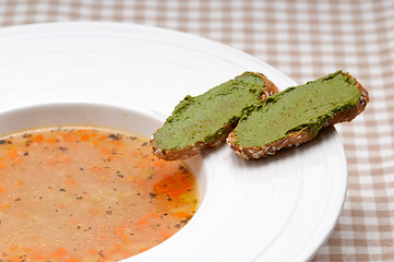 Image showing Italian minestrone soup with pesto crostini on side