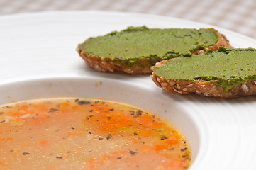 Image showing Italian minestrone soup with pesto crostini on side