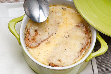 Image showing oinion soup with melted cheese and bread on top