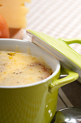 Image showing oinion soup with melted cheese and bread on top