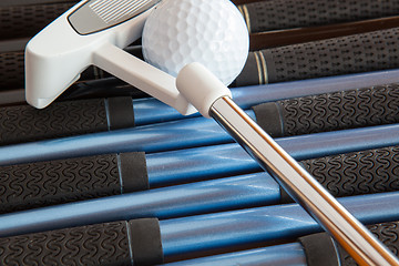 Image showing Golf putter and golf clubs