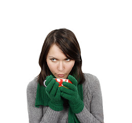 Image showing Woman drinking a hot beverage 