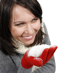 Image showing Woman blowing snow