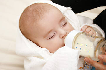 Image showing Baby drinking milk